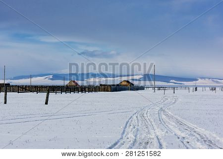 Winter Village View. Snow Covered Mountains. Moubtains, Buildings