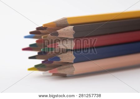 Colored Pencil Out Of Focus On White Background.