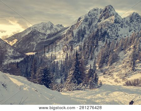 Spectacular Winter Mountain Landscape Illuminated By Setting Sun.