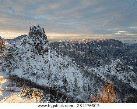 Spectacular Winter Mountain Landscape Illuminated By Setting Sun.