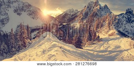 Spectacular Winter Mountain Landscape Illuminated By Setting Sun.