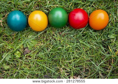 Easter Colorful Eggs In Fresh Green Grass. - Yellow, Green, Red, Orange And Blue Eggs. Spring, Easte