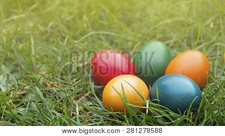 Easter Colorful Eggs In Fresh Green Grass. - Yellow, Green, Red, Orange And Blue Eggs. Spring, Easte