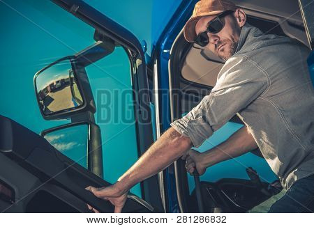 Transportation Industry. Semi Truck Driving. Caucasian Driver In His 30s Is About To Hit The Road Wi