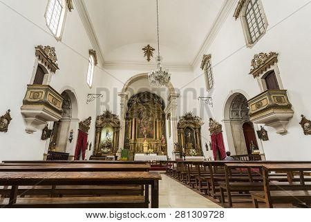 Coimbra, Portugal - July 18, 2018:  View Of The Nave And Main Chapel Of St Bartholomew Church With A