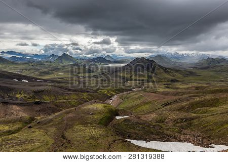 Dramatic Iceland Landscape With Green Mountains Covered With Thick Icelandic Moss And Snow Patches O