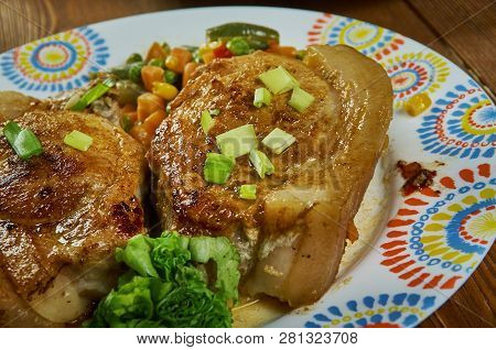 Chuletas A La Jardinera, Garden Pork Chops In A Tomato Sauce With Fresh Carrots, Corn, Green Beans.