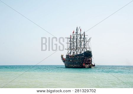 Turkler, Turkey - August 3, 2018: A Large White Pirate-style Sailing Ship Is Moored Near The Coast A