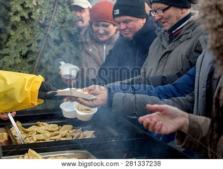 Cracow, Poland - December 16, 2018: Christmas Eve For Poor And Homeless On The Main Square In Cracow