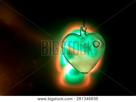 Valentines Day Concept. Glass Transparent Heart On Dark. Crystal Heart In The Dark, Glass Heart Glow