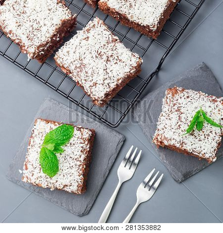 Homemade Brownie With Coconut Flakes, Swedish Dessert Karleksmums, Cut In Square Servings, On Stone 