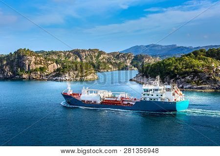Norwegian Landscape With Blue Fjord Water, Tanker And Colorful Houses, Norway