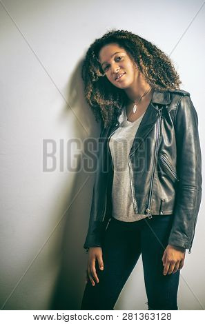 Portrait of a mixed race pretty teenage girl in the studio