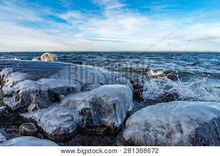 Icy Stones On Beach Near Lake Vattern