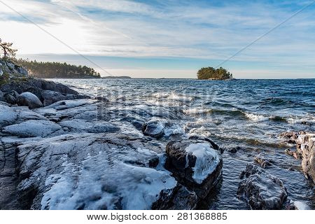 Icy Stones On Beach Near Lake Vattern