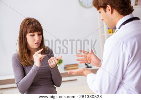 Deaf-mute female patient visiting young male doctor 