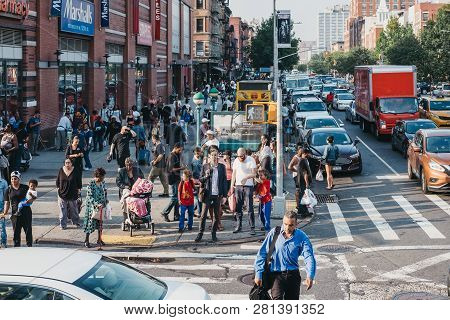 New York, Usa - June 01, 2018: People Walking On A Street In Harlem, Nyc. Since The 1920s, Harlem Ha
