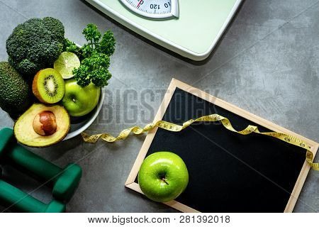 Diet And Healthy Life Loss Weight Concept. Green Apple And Weight Scale Measure Tap With Fresh Veget