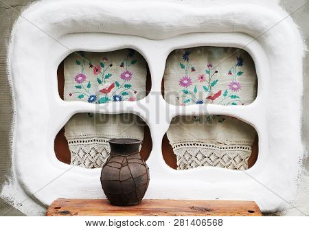 Old Window In The Ukrainian Village. Embroidery And Glechik On The Window