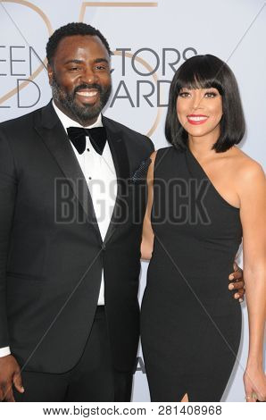 LOS ANGELES - JAN 27:  Bashir Salahuddin, Chadra Russell at the 25th Annual Screen Actors Guild Awards at the Shrine Auditorium on January 27, 2019 in Los Angeles, CA