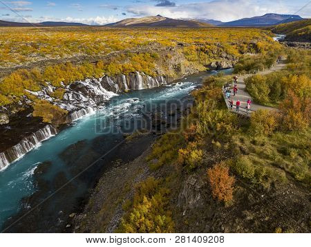 Aerial View Of Autumn Foliage At Hraunfossar Waterfalls In Husafell, West Iceland