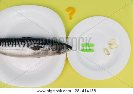 Oily Fish Mackerel And (or) Food Supplement Omega-3 In Capsules. Concept Of Choice. The Photo Is Wri