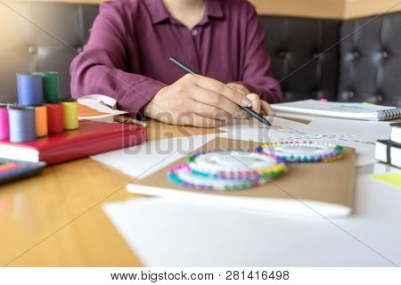 Young Woman Professional Fashion Designer Working And Drawing Sketches On The Table , Designer Styli