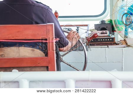 Navigator (helmsman) Is Responsible For Position Of Ferry Boat By Controlling Steering Wheel (helm, 