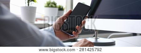 Businessman Hipster Holds Telephone Background Of Computer Keyboard In Office Clodeup. Make Transact