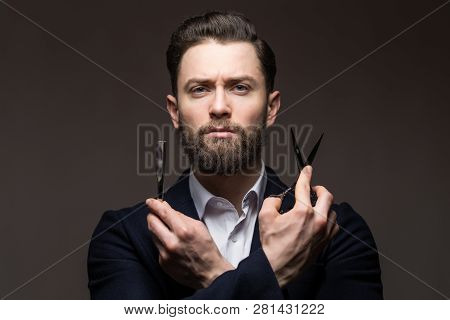 Bearded Young Man Caucasian Hipster With Moustache Holding Scissors And Straight Razor On Gray Backg