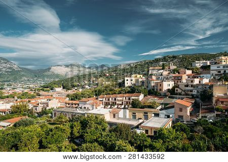 Terracina, Italy. Top View Of Residential Area. Hilly Cityscape In Summer Sunny Day Under Blue Cloud