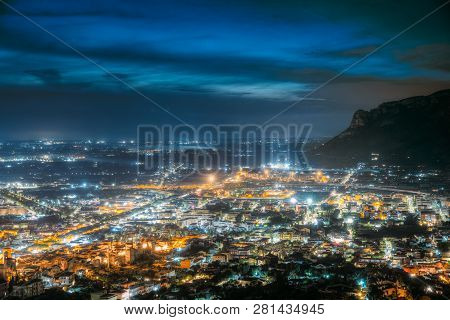 Terracina, Italy. Top View Skyline Cityscape In Evening Night Illuminations.
