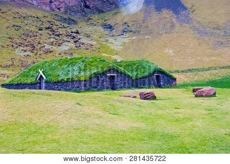 House With Grass Roof In Heimaey, Iceland. Green And Eco House Architecture. Ecology And Environment