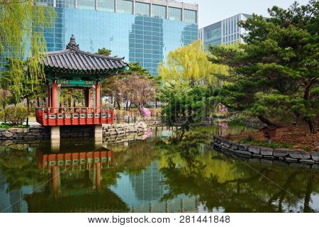 Yeouido Park public park pond with pavilion summerhouse in Seoul, Korea