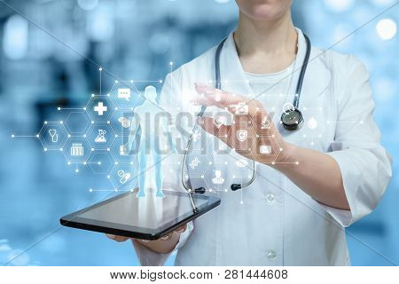 A Closeup Of Doctor Operating With Medical Icons Combs And Human Body Model System Above The Gadget 