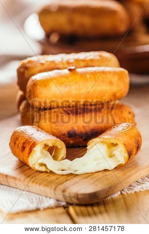 Cheese Fingers, Typical Venezuelan Appetizer Called Tequeños  On A Wooden Board