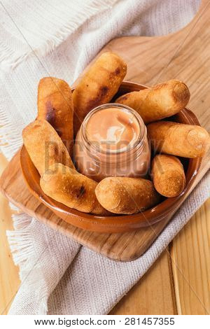 Top View Of Latin-american Appetizers Called Tequeños Made Of Fried Corn Filled With Cheese With A P
