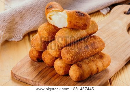 Cheese Fingers, Typical Venezuelan Appetizer Called Tequeños  On A Wooden Board