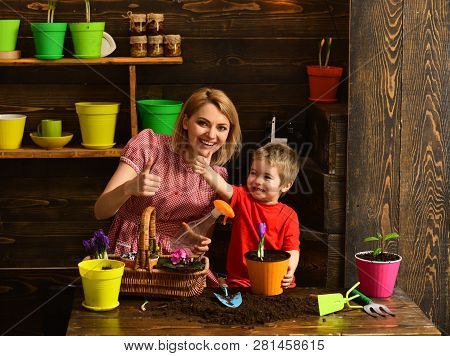 Family Concept. Happy Family Smile With Thimbs Up Hands. Family Planting Flowers At Home. Little Chi
