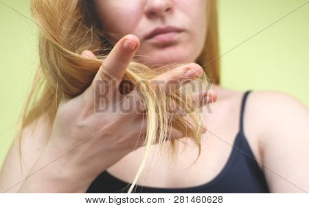 Damaged Hair. Beautiful Sad Young Woman With Long Disheveled Hair. Hair Damage, Health And Beauty Co