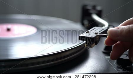 Cinemagraph Loop Vintage Vinyl Turntable Record Player With Female Hand Holding Niddle