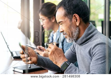 Attractive Mature Asian Man With White Stylish Short Beard Hispter Looking Smartphone Reading News O
