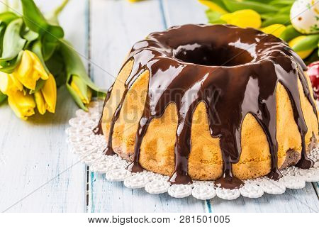 Delicious Holiday Slovak And Czech Cake Babovka With Chocolate Glaze. Easter Decorations - Spring Tu