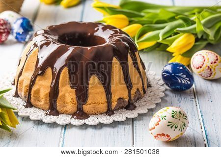 Delicious Holiday Slovak And Czech Cake Babovka With Chocolate Glaze. Easter Decorations - Spring Tu
