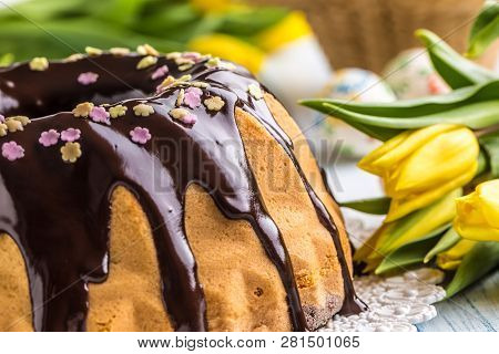 Delicious Holiday Slovak And Czech Cake Babovka With Chocolate Glaze. Easter Decorations - Spring Tu