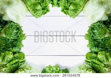 Fresh Lettuce Salad, Green Vegetable On White Wood Background, Top View With Coopy Space.