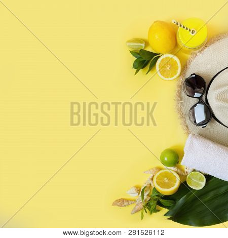 Straw Fomans Hat, Sun Glasses And Beach Accessory With Detox Citrics Water On Yellow. Top View. Flat