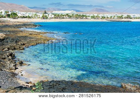 View Of Playa De Las Cucharas Beach In Costa Teguise, Lanzarote, Spain, Turquoise Waters, Selective 