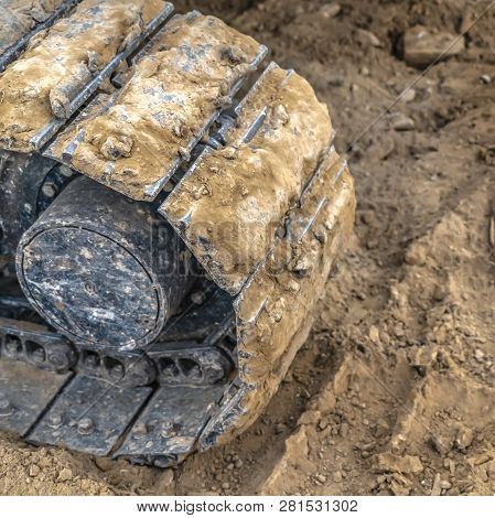 Excavator Track Pad And Tread Mark On Dirt