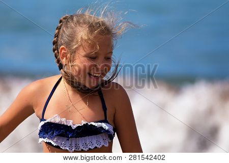 TÜrkler Mahallesi, Turkey - October 9, 2017: The Girl Is Playing By The Sea